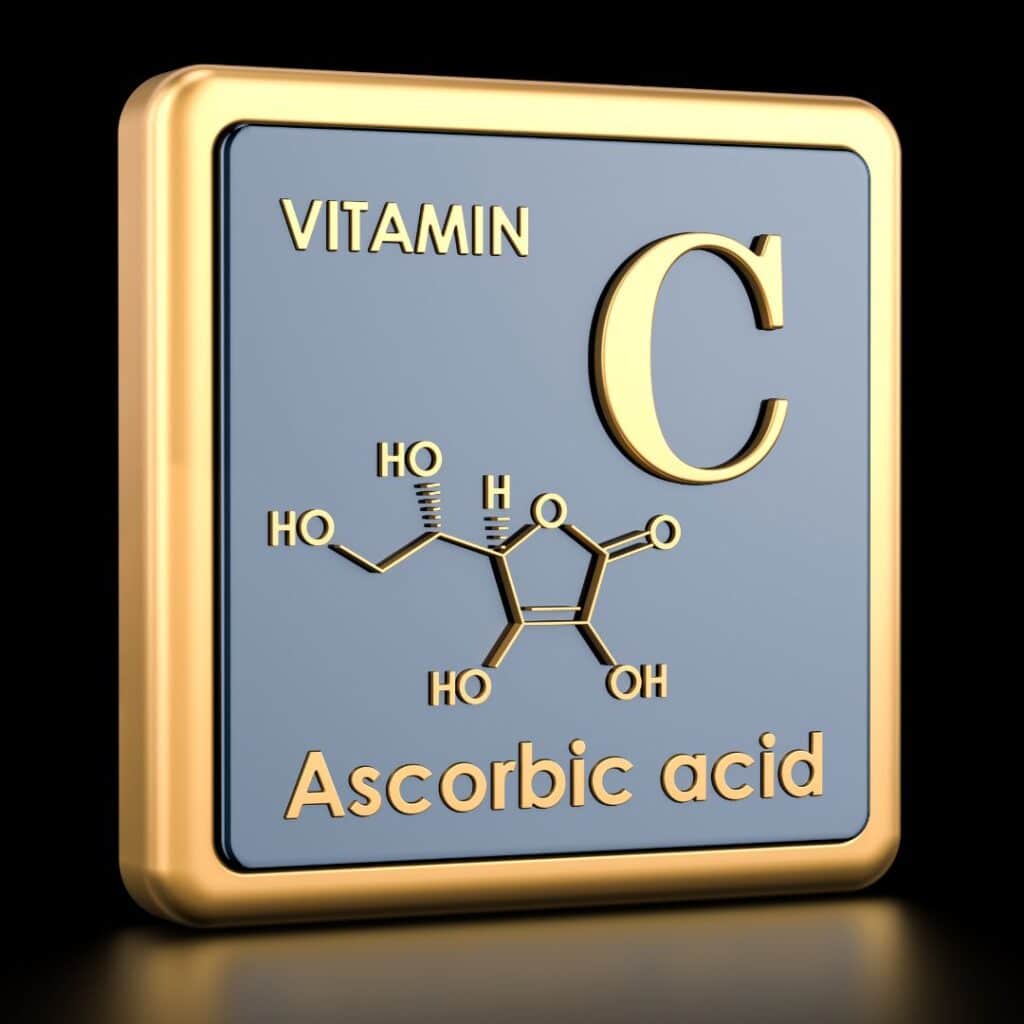Simbolo di vitamina C con formula chimica dell'acido ascorbico.